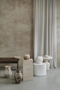 sculptural arrangement of ceramic pottery vases in neutral and natural colours